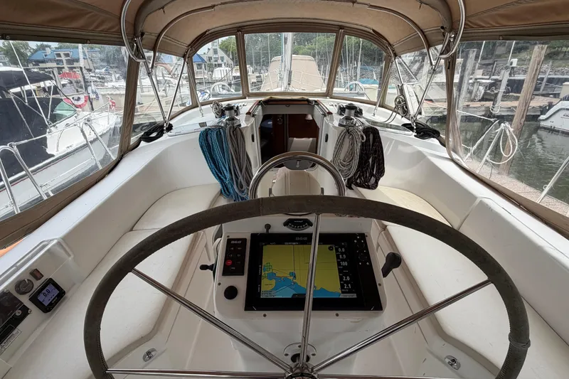 Slide: The Image of Cockpit view of a 2007 Beneteau 423 sailboat with navigation equipment. - 12