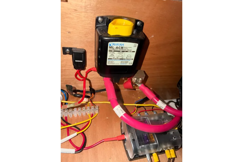 Slide: The Image of Electrical setup on a 2007 Beneteau 423 yacht, featuring a Blue Sea ML-ACR relay. - 55