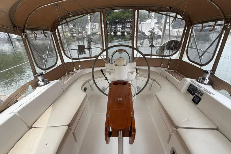 Slide: The Image of Interior view of 2007 Beneteau 423 sailboat cockpit with steering wheel and seating. - 18