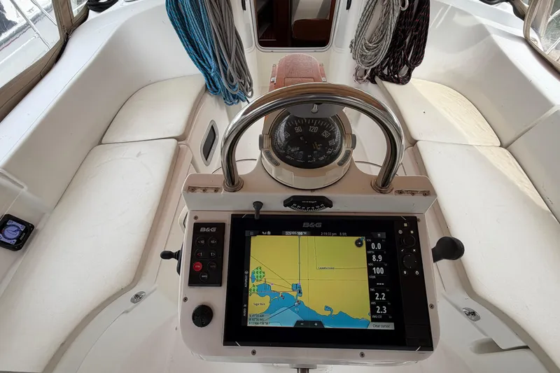 Slide: The Image of Cockpit of 2007 Beneteau 423 sailboat with navigation equipment and compass. - 13
