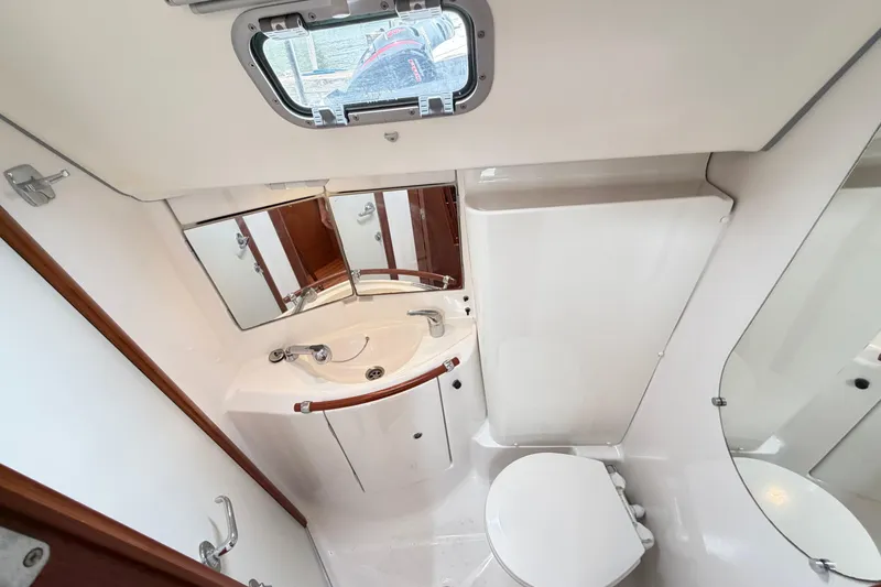 Slide: The Image of Bathroom interior of 2007 Beneteau 423 yacht, featuring sink, toilet, and mirror. - 41