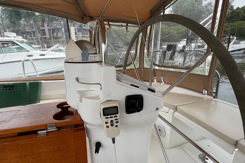 Slide: The Image of Cockpit of 2007 Beneteau 423 sailboat with steering wheel and navigation equipment. - 17