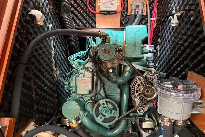 Slide: The Image of Engine compartment of a 2007 Beneteau 423 sailboat, showcasing mechanical components. - 46