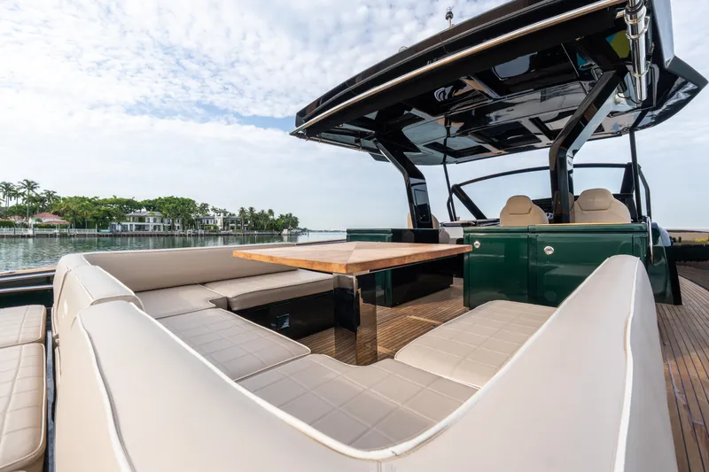 Slide: The Image of Luxurious 2020 Pardo Yachts 50 with elegant seating and table on deck. - 55