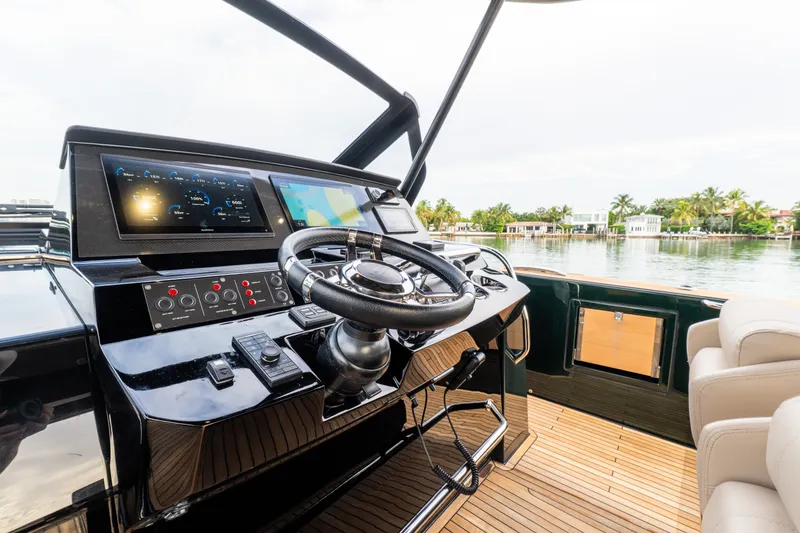 Slide: The Image of Helm of 2020 Pardo Yachts 50 with modern controls and scenic water view. - 88