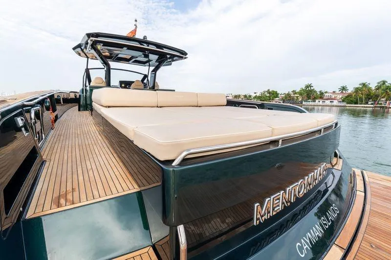 Slide: The Image of Luxurious 2020 Pardo Yachts 50 with spacious deck, docked near tropical shoreline. - 47