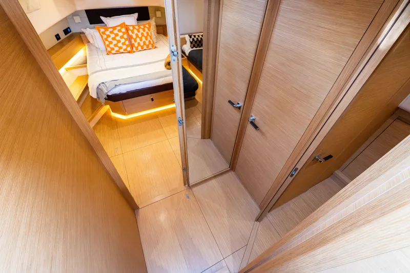 Slide: The Image of Luxurious cabin interior of 2020 Pardo Yachts 50 with modern wood finish and cozy bedding. - 65