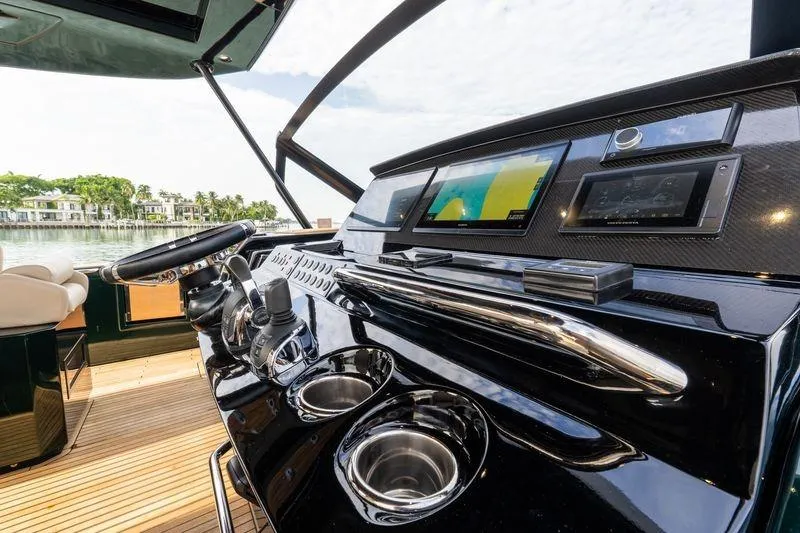 Slide: The Image of Helm of 2020 Pardo Yachts 50 with modern navigation displays and controls. - 54