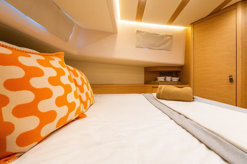 Slide: The Image of Luxurious cabin interior of 2020 Pardo Yachts 50 with stylish bedding and warm lighting. - 73