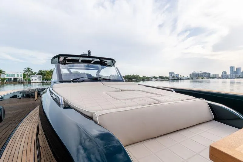Slide: The Image of Luxury 2020 Pardo Yachts 50 on calm waters with city skyline backdrop. - 58