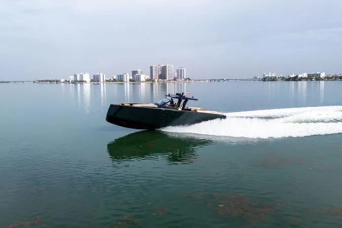 Slide: The Image of 2020 Pardo Yachts 50 cruising on calm waters near a city skyline. - 23
