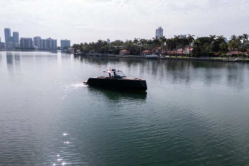 Slide: The Image of 2020 Pardo Yachts 50 cruising on a calm urban waterfront. - 43