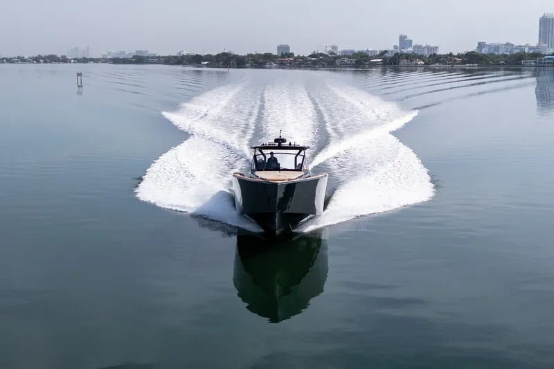 Slide: The Image of Pardo Yachts 50 (2020) cruising on calm waters with city skyline in background. - 30