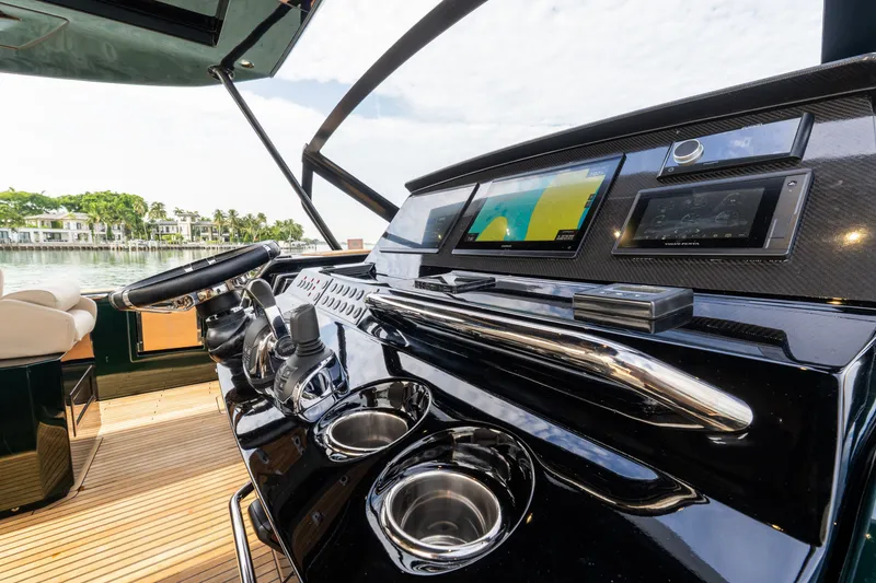 Slide: The Image of Helm of 2020 Pardo Yachts 50 with modern navigation displays and controls. - 51