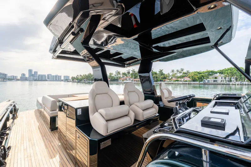 Slide: The Image of Luxurious 2020 Pardo Yachts 50 interior with plush seating and sleek design on a serene waterfront. - 52
