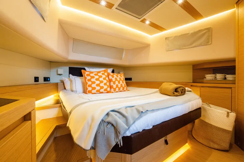 Slide: The Image of Luxurious cabin interior of 2020 Pardo Yachts 50 with cozy bedding and ambient lighting. - 67