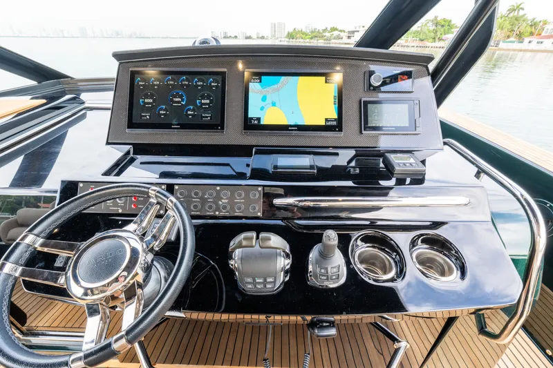 Slide: The Image of Helm of 2020 Pardo Yachts 50 with advanced navigation displays and controls. - 90