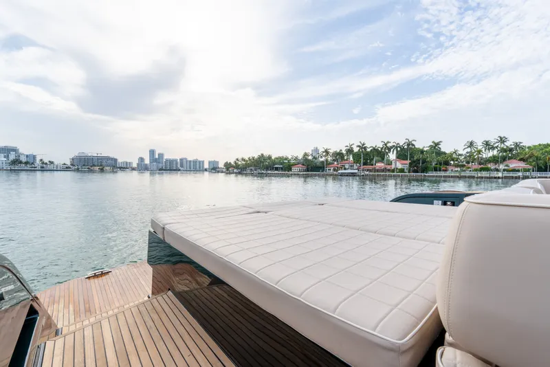 Slide: The Image of Luxurious 2020 Pardo Yachts 50 with spacious deck, overlooking serene waterfront and skyline. - 62