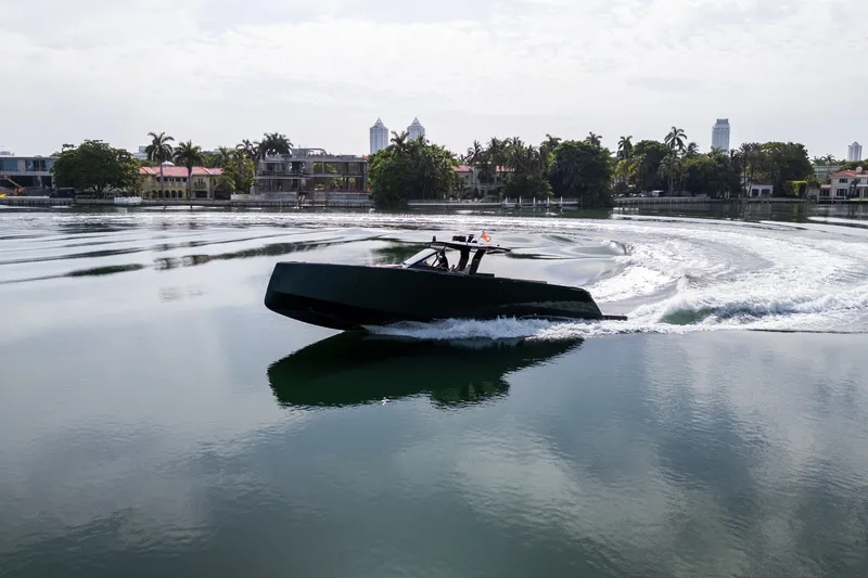 Slide: The Image of 2020 Pardo Yachts 50 cruising on a calm waterway with scenic background. - 23