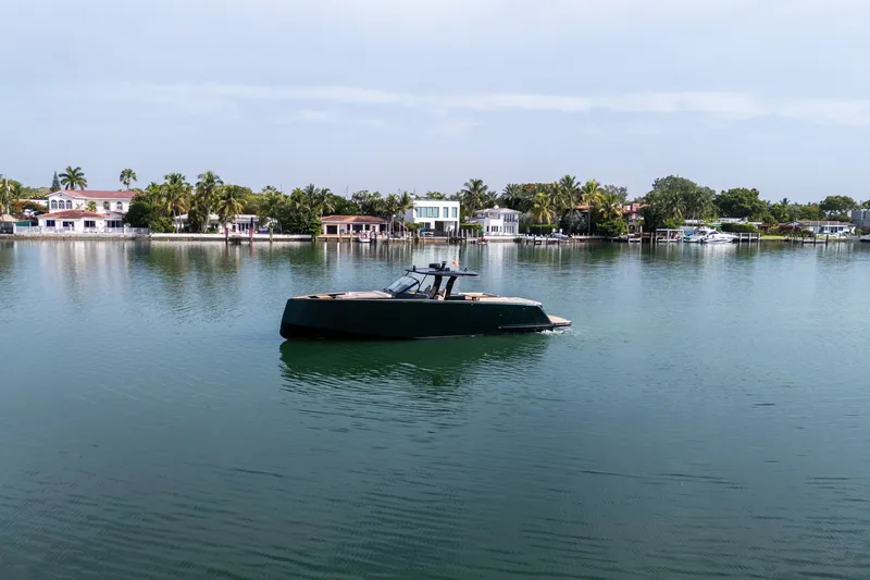 Slide: The Image of 2020 Pardo Yachts 50 cruising on calm waters near waterfront homes. - 40