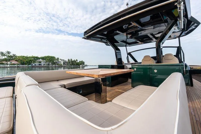 Slide: The Image of Luxurious 2020 Pardo Yachts 50 with elegant seating and table on deck. - 49