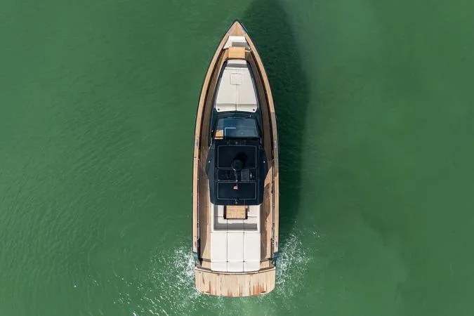Slide: The Image of Overhead view of 2020 Pardo Yachts 50 cruising on green water. - 19