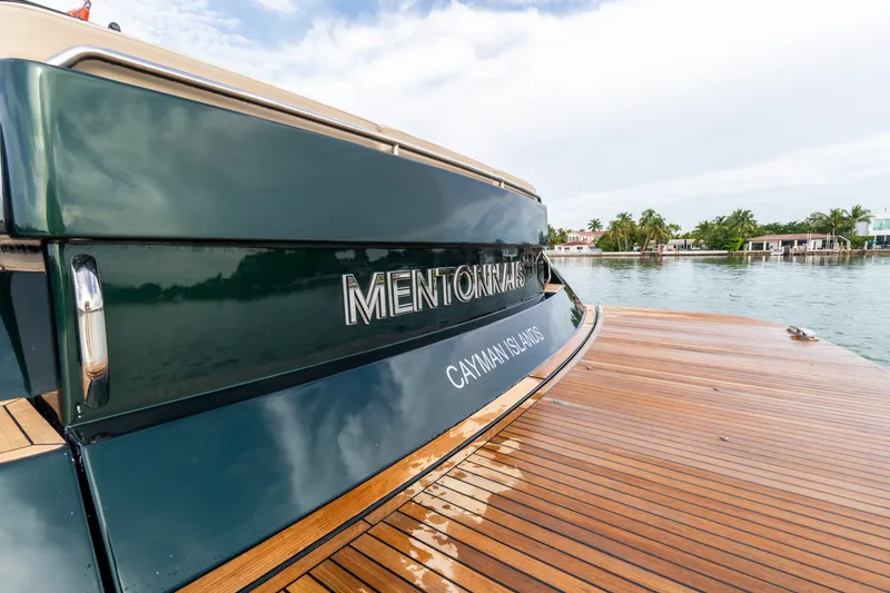 Slide: The Image of Pardo Yachts 50, 2020 model, docked with wooden deck and scenic waterfront view. - 59