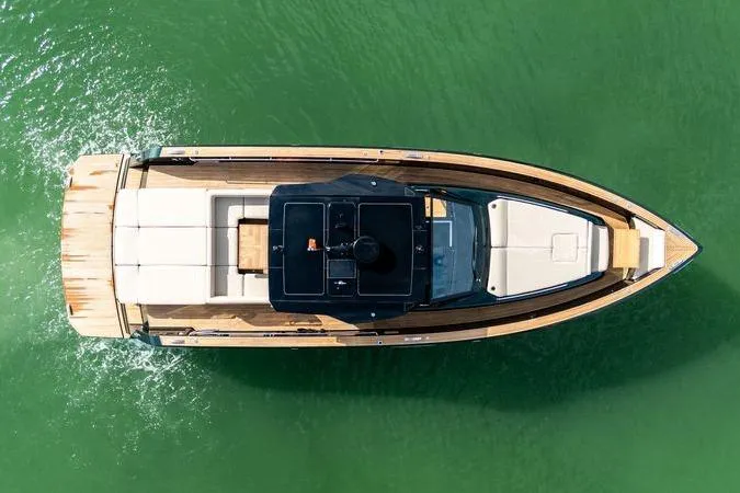 Slide: The Image of Overhead view of 2020 Pardo Yachts 50 cruising on green water. - 18