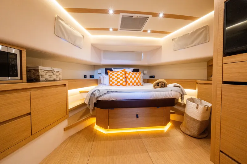 Slide: The Image of Luxurious 2020 Pardo Yachts 50 cabin interior with modern wood finish and ambient lighting. - 66