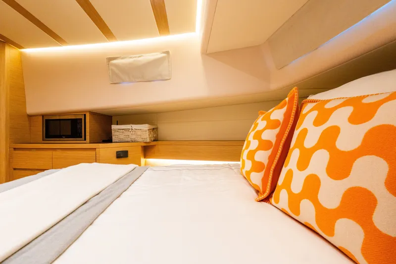 Slide: The Image of Luxurious cabin interior of 2020 Pardo Yachts 50 with vibrant orange pillows. - 72