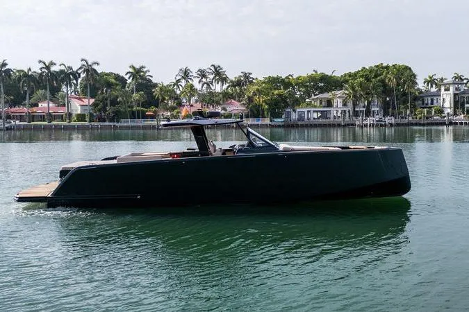 Slide: The Image of 2020 Pardo Yachts 50 cruising on calm waters near luxury waterfront homes. - 41