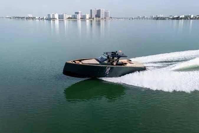 Slide: The Image of 2020 Pardo Yachts 50 cruising on calm waters near a city skyline. - 24