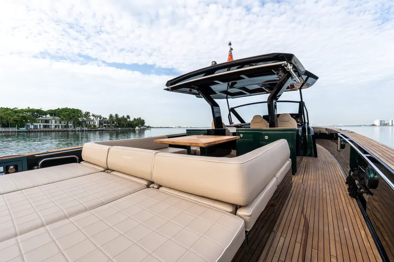Slide: The Image of Luxurious 2020 Pardo Yachts 50 with elegant deck and seating, cruising on calm waters. - 61