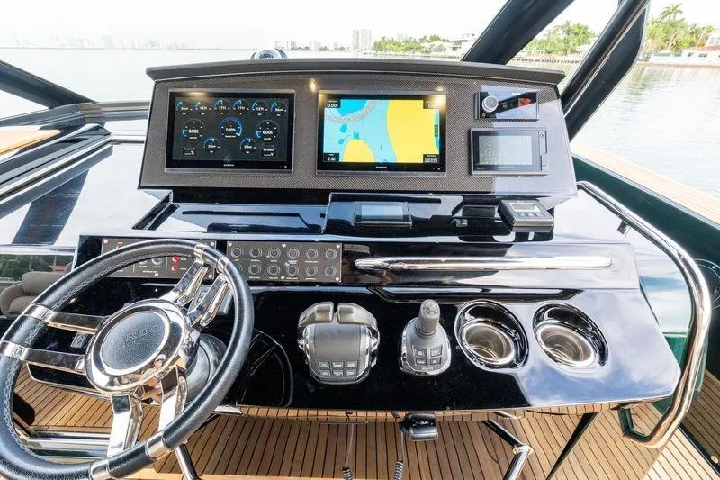 Slide: The Image of Helm of 2020 Pardo Yachts 50 with navigation screens and controls. - 59