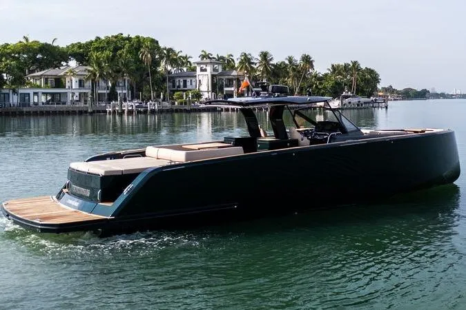 Slide: The Image of 2020 Pardo Yachts 50 cruising on a serene waterfront with lush greenery. - 32