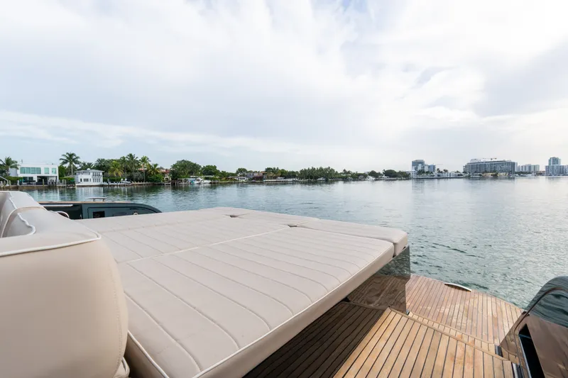 Slide: The Image of Luxurious 2020 Pardo Yachts 50 with spacious deck overlooking serene waterfront view. - 63