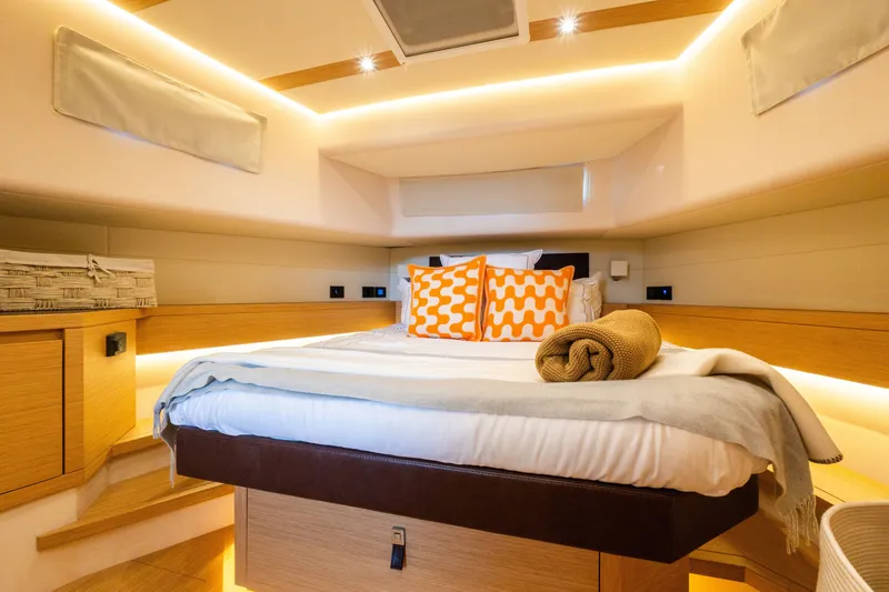 Slide: The Image of Luxurious cabin interior of 2020 Pardo Yachts 50 with modern bedding and ambient lighting. - 68