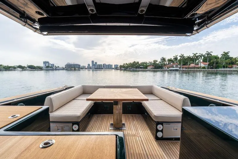 Slide: The Image of Luxurious 2020 Pardo Yachts 50 with elegant seating and scenic waterfront view. - 56