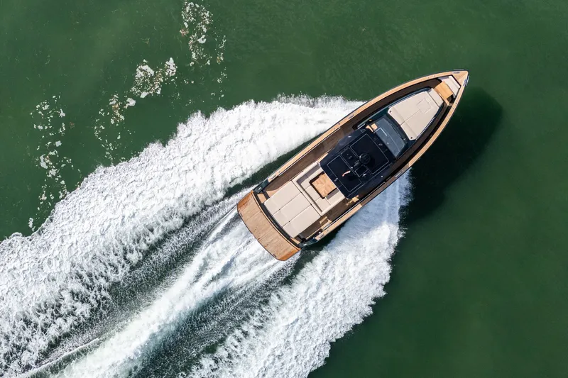 Slide: The Image of Aerial view of 2020 Pardo Yachts 50 cruising on green water. - 21