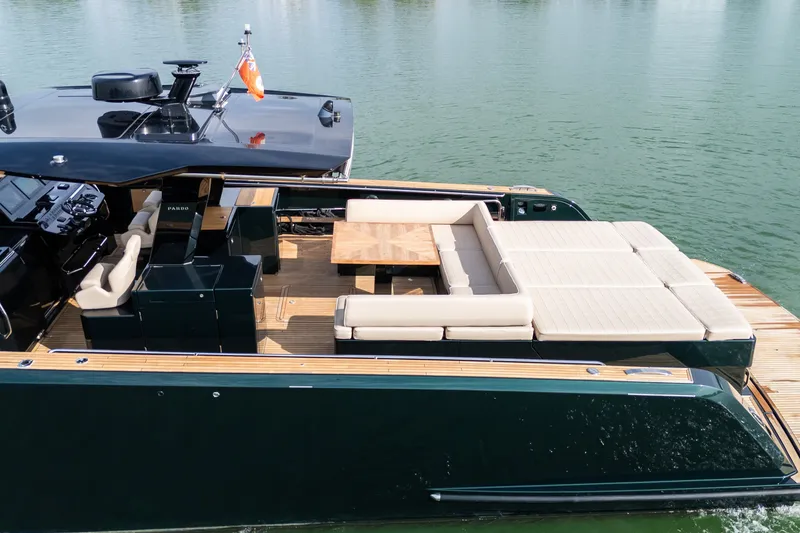 Slide: The Image of Luxurious 2020 Pardo Yachts 50 with spacious deck and elegant seating on calm waters. - 6