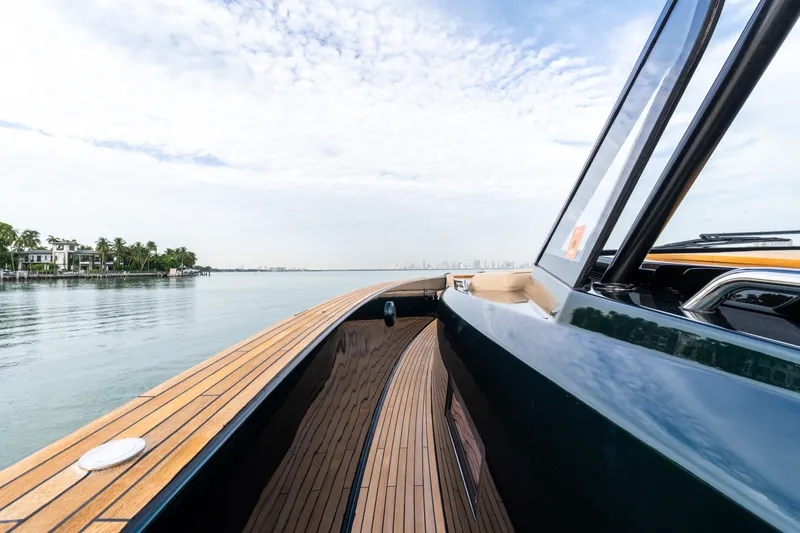 Slide: The Image of 2020 Pardo Yachts 50 cruising on calm waters with a sleek wooden deck. - 83