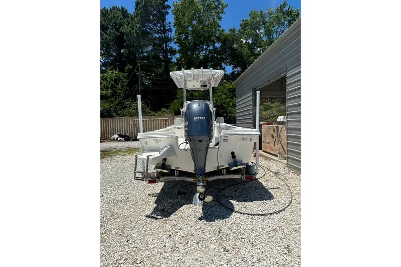 Slide: The Image of 2021 KenCraft Bayrider boat with Yamaha 200 engine, parked outdoors on gravel. - 8