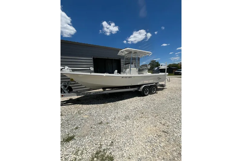 The Image of 2021 KenCraft Bayrider boat on trailer, parked outdoors under a clear blue sky. - 1