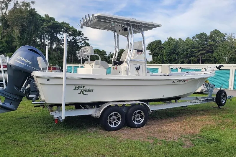 Slide: The Image of 2021 KenCraft Bayrider boat on trailer with Yamaha engine, parked on grass. - 19