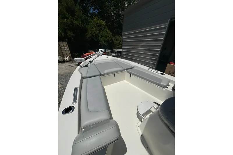 Slide: The Image of 2021 KenCraft Bayrider boat interior with cushioned seating and storage compartments. - 11