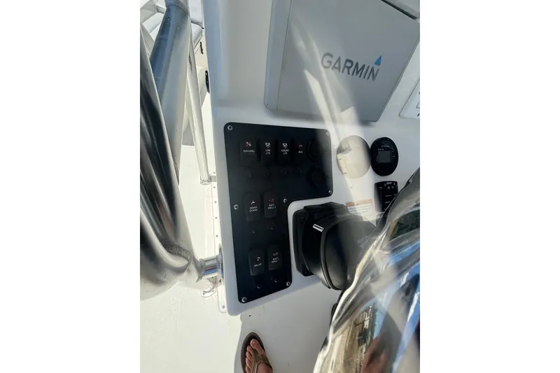 Slide: The Image of 2021 KenCraft Bayrider boat dashboard with Garmin navigation system and control panel. - 14