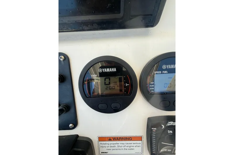 Slide: The Image of Yamaha gauges on 2021 KenCraft Bayrider boat dashboard, displaying tachometer and speed fuel indicators. - 6