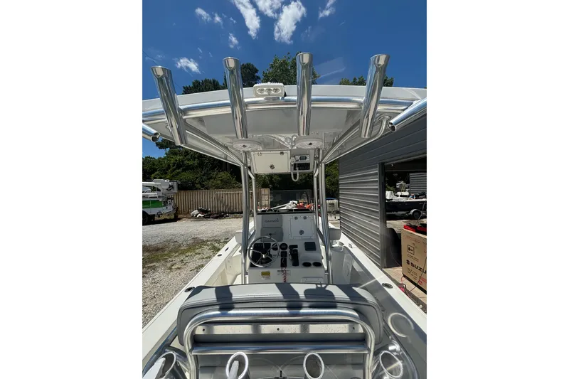 Slide: The Image of 2021 KenCraft Bayrider boat interior with T-top and control console under clear blue sky. - 7