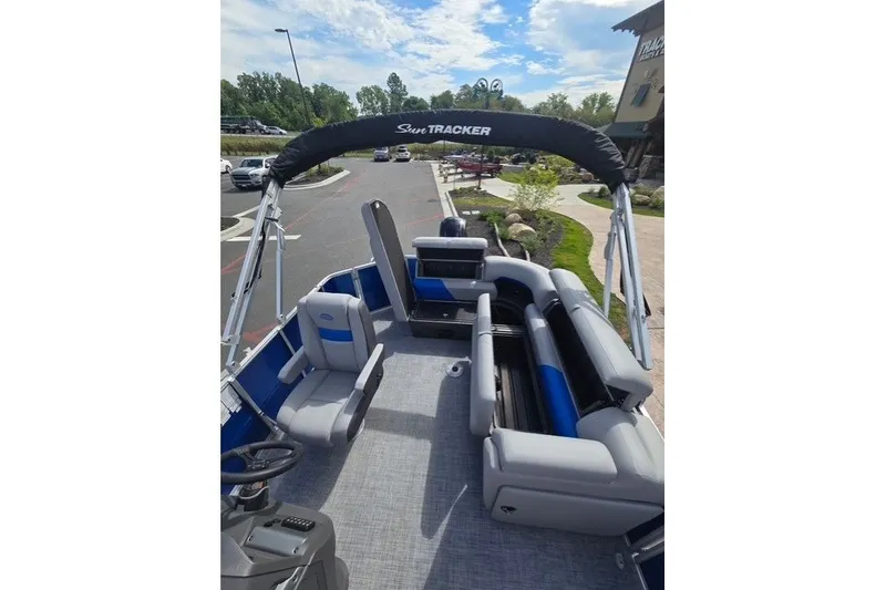 Slide: The Image of 2026 Sun Tracker Party Barge 20 DLX pontoon boat with spacious seating and canopy. - 81