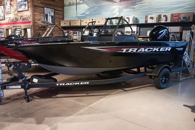 The Image of 2026 Tracker Pro Guide V-175 WT boat displayed in showroom setting. - 0